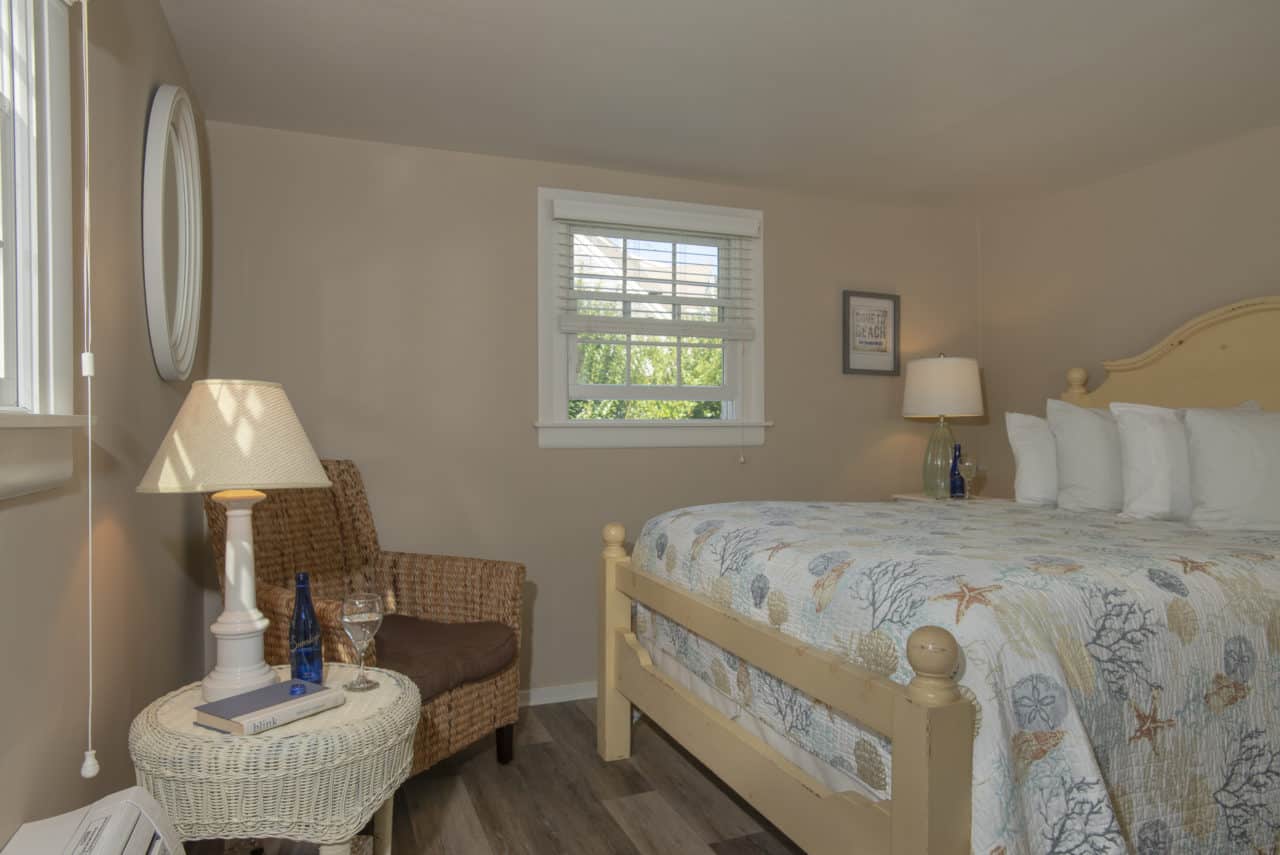 the queen bed with view of gardens in the background