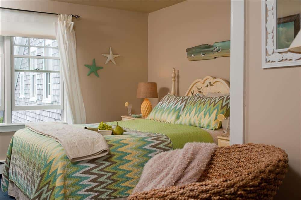 Room 9 green bedspread and queen bed