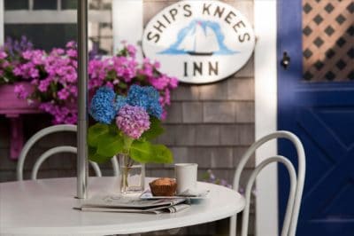 Breakfast outdoors at a patio table in the Ships Knees courtyard