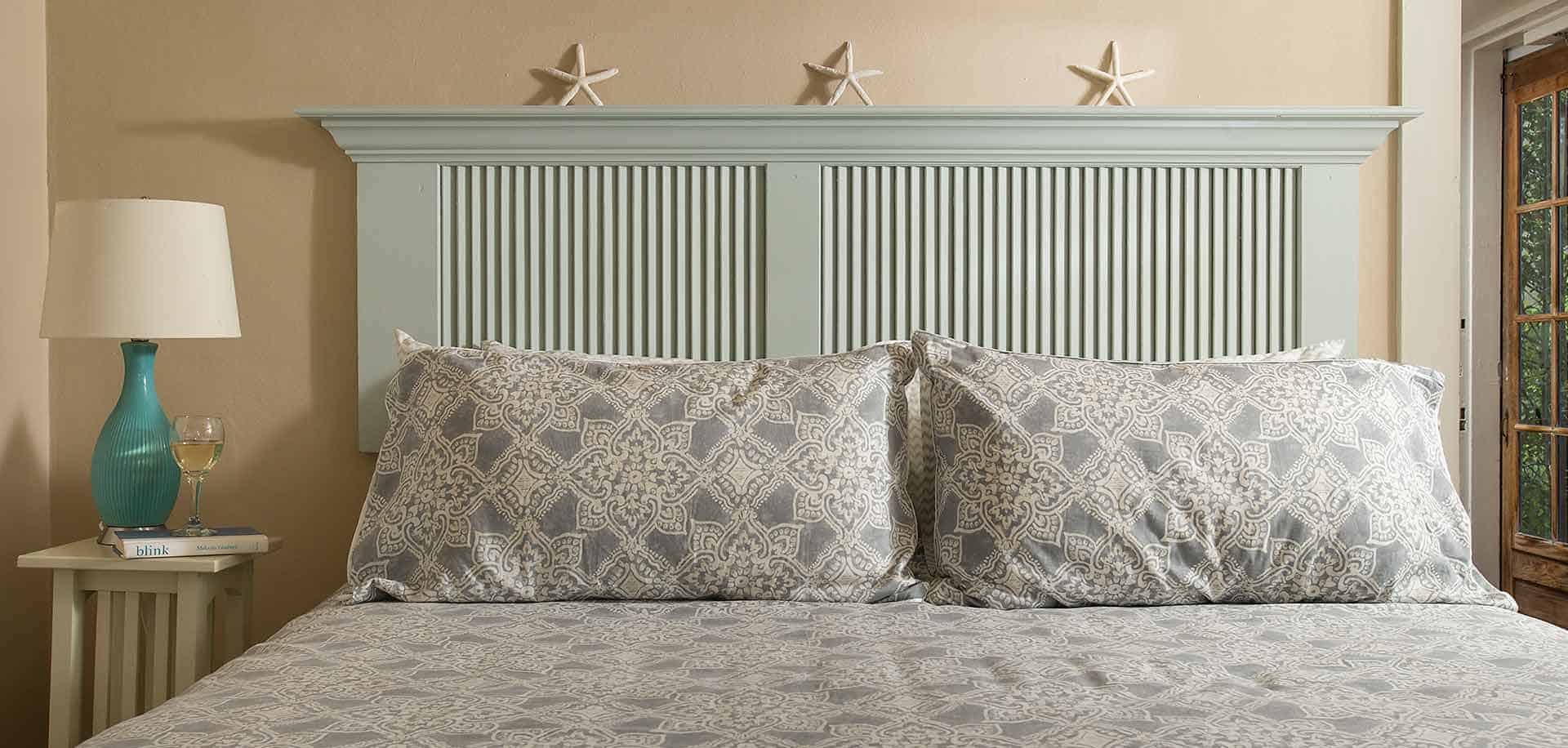 King room bed with starfish decor and headboard