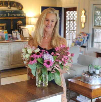 Denise arranges fresh flowers