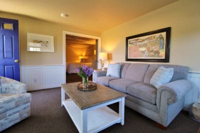 The nauset Suite sitting area with couch and TV